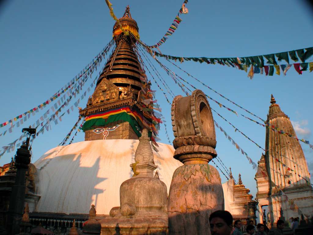 Manaslu 00 10 Kathmandu Swayambhunath From Boudhanath I took a taxi to the �monkey� temple, Swayambhunath, which shone beautifully in the late afternoon sun. The earliest record of this stupa's existence dates from a 5C stone inscription; however, scholars and archaeologists believe that there was probably a shrine here as far back as 2,000 years ago.
